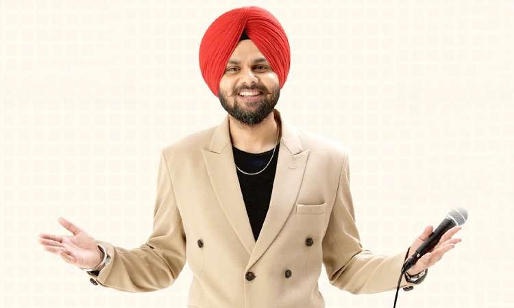 Jaspreet Singh holding a microphone